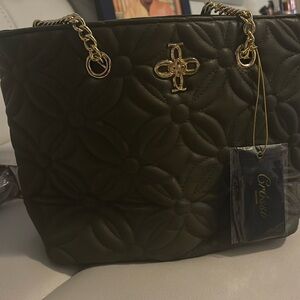 This is a olive green purse tag still on it brand o never used